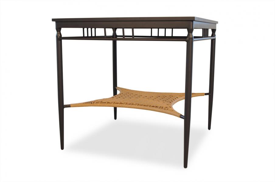 A modern desk with dark wood frame and a woven rattan shelf, isolated on a white background, featuring an insert fireplace.