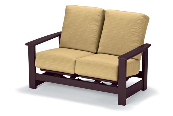 A modern two-seater glider loveseat with a dark brown wooden frame and plush light beige cushions, isolated on a white background, accompanied by a rustic fire pit.