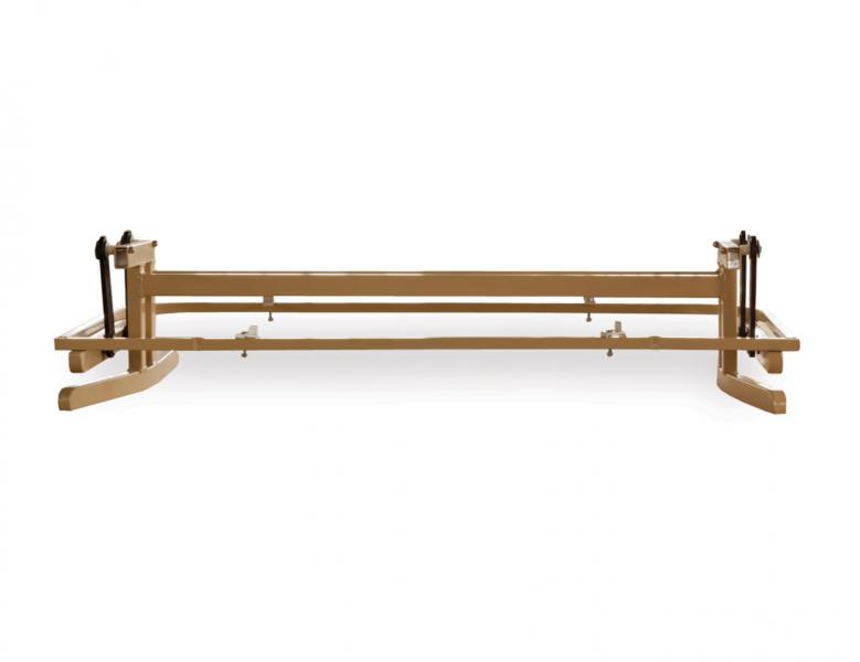 A golden metal frame bed base isolated on a white background, designed to support a mattress without needing a box spring or insert.