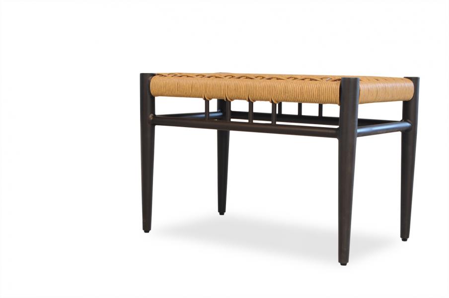 A modern bench with a dark wooden frame and a woven tan seat, featuring a fire pit insert, isolated on a white background.