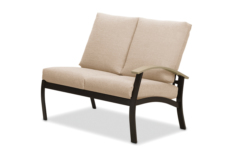 A modern two-seater sofa with beige cushions and a sleek black frame, isolated on a white background near a fire pit.