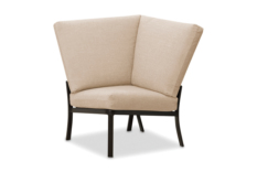 A modern corner chair with beige upholstery and a black metal frame, featuring a built-in stove, isolated on a white background.