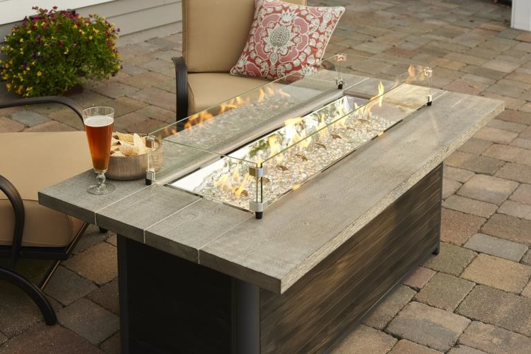 top view of Cedar Ridge gas fire pit with Gray Wash Cedar Supercast concrete top and taupe-colored decking base