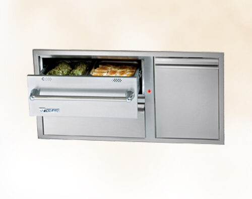 A modern, wall-mounted bread warming drawer with a stainless steel finish, partially open to reveal loaves of bread inside an insert.