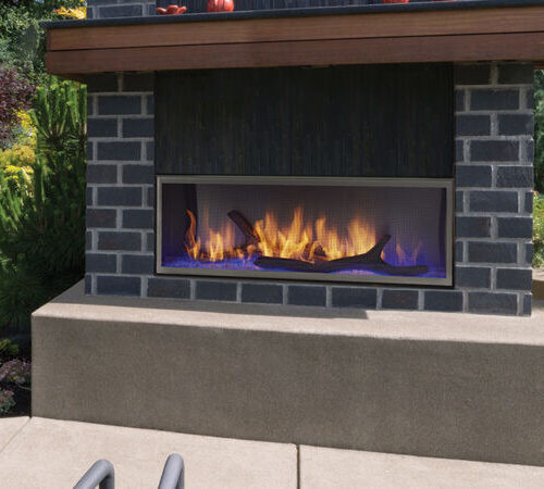 Lanai outdoor gas fireplace by Outdoor Lifestyles with wood kit and dark gray brick hearth in modern patio