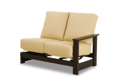 A modern beige futon with a dark wooden frame, isolated on a white background. The futon is in a semi-reclined position near an elegant fireplace, showcasing both its seat and back cushion