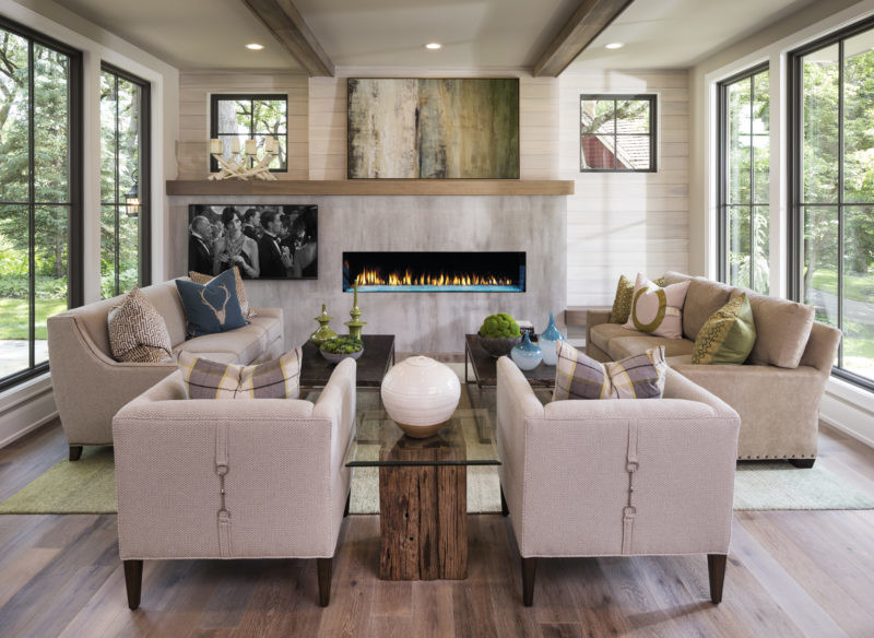 Primo single-sided gas fireplace by Heat & Glo with Aqua Light LED lighting against a modern gray concrete style hearth