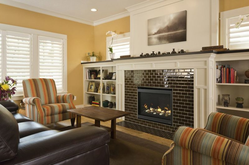 SlimLine Fusion series gas fireplace by Heat & Glo in black with Clean Face front against a ceramic brick pattern hearth