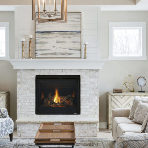 SlimLine series gas fireplace by Heat & Glo in black with Firescreen front against a white brick hearth