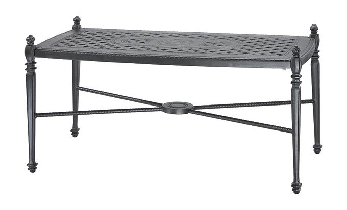 A rectangular Gensun Grand Terrace wrought iron coffee table with an ornate lattice top, decorative knobs at each corner, and a lower shelf featuring a central circular motif.