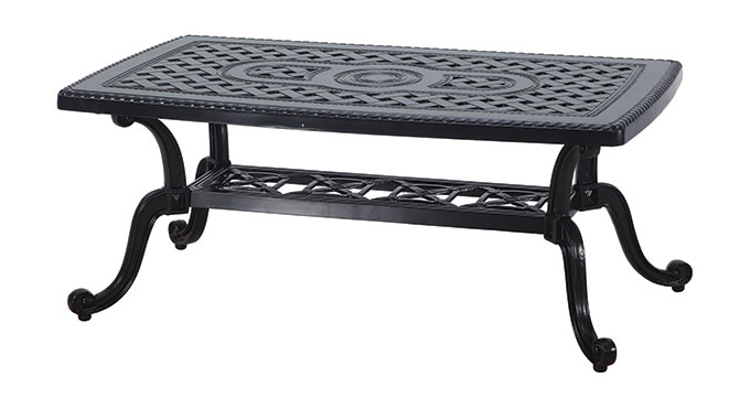 A rectangular black cast iron coffee table from the Gensun Grand Terrace collection, featuring ornate scroll designs on both the tabletop and lower shelf, set against a white background.