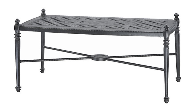 A rectangular, ornate Gensun Grand Terrace cast iron table with intricate patterns on the tabletop, decorative legs, and a cross beam support. The table is painted in a dark color, likely black