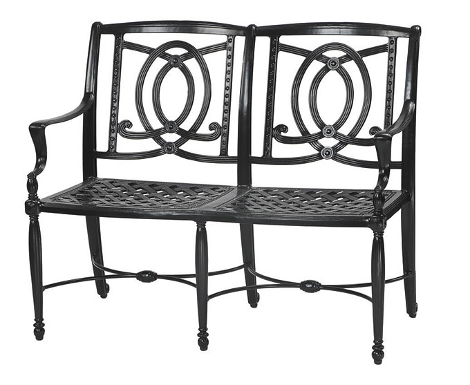 A Gensun Bel Air black metal garden bench with decorative circular patterns and intricate detailing on the backrest, featuring a woven metal seat and armrests.