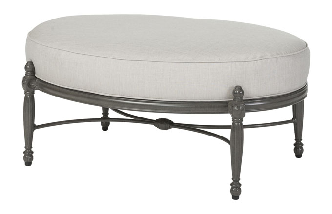 Oval-shaped ottoman with a light gray cushion and a dark gray, Gensun Bel Air metal base featuring ornate, classic detailing.