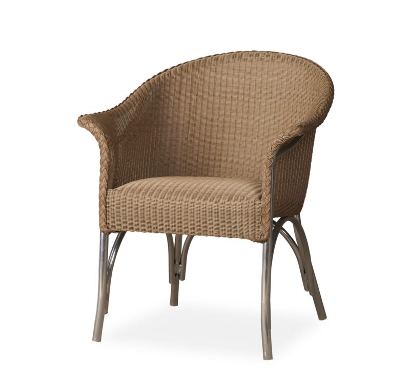 A wicker armchair with a curved back and armrests, supported by metal legs, isolated on a white background.