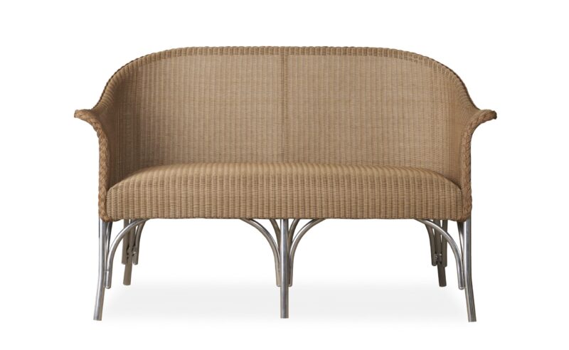 A wicker sofa with curved arms and metal legs, displayed against a white background.