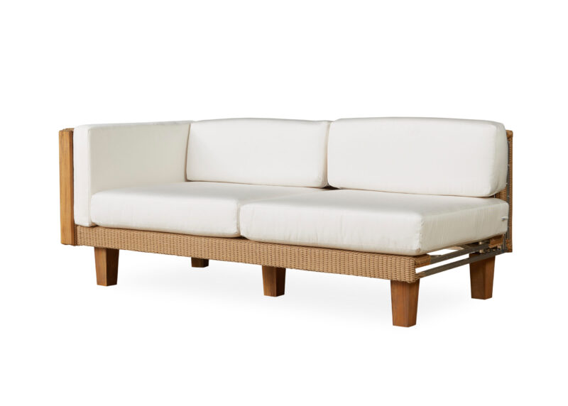 Modern three-seater sofa with white cushions and a wooden frame, featuring a woven rattan detail on the sides, isolated on a white background.