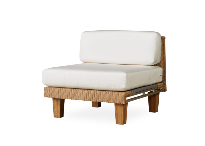 A modern single-seat sofa with a wooden frame and wicker sides, featuring thick, white cushions on its seat and backrest, isolated on a white background.