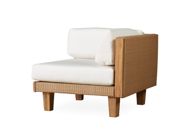 A modern wicker armless chair with a sturdy wooden frame, featuring thick white cushions on the seat and back, isolated on a white background.