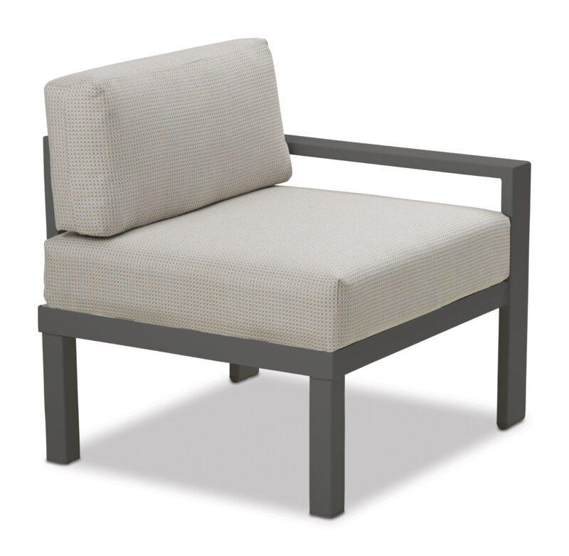 A modern single-seater sofa with a gray metal frame and light beige cushions isolated on a white background.