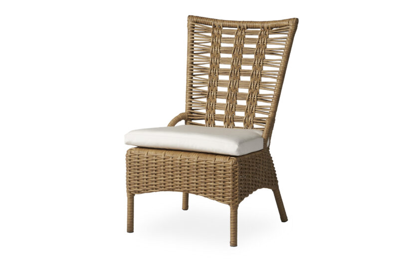 A high-back rattan dining chair with a cushioned seat on a white background. the chair features a natural woven texture and a modern, elegant design.