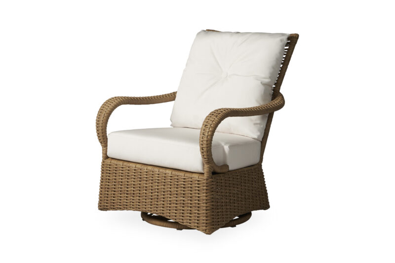 A comfortable rattan swivel chair with thick, white cushions on a white background.