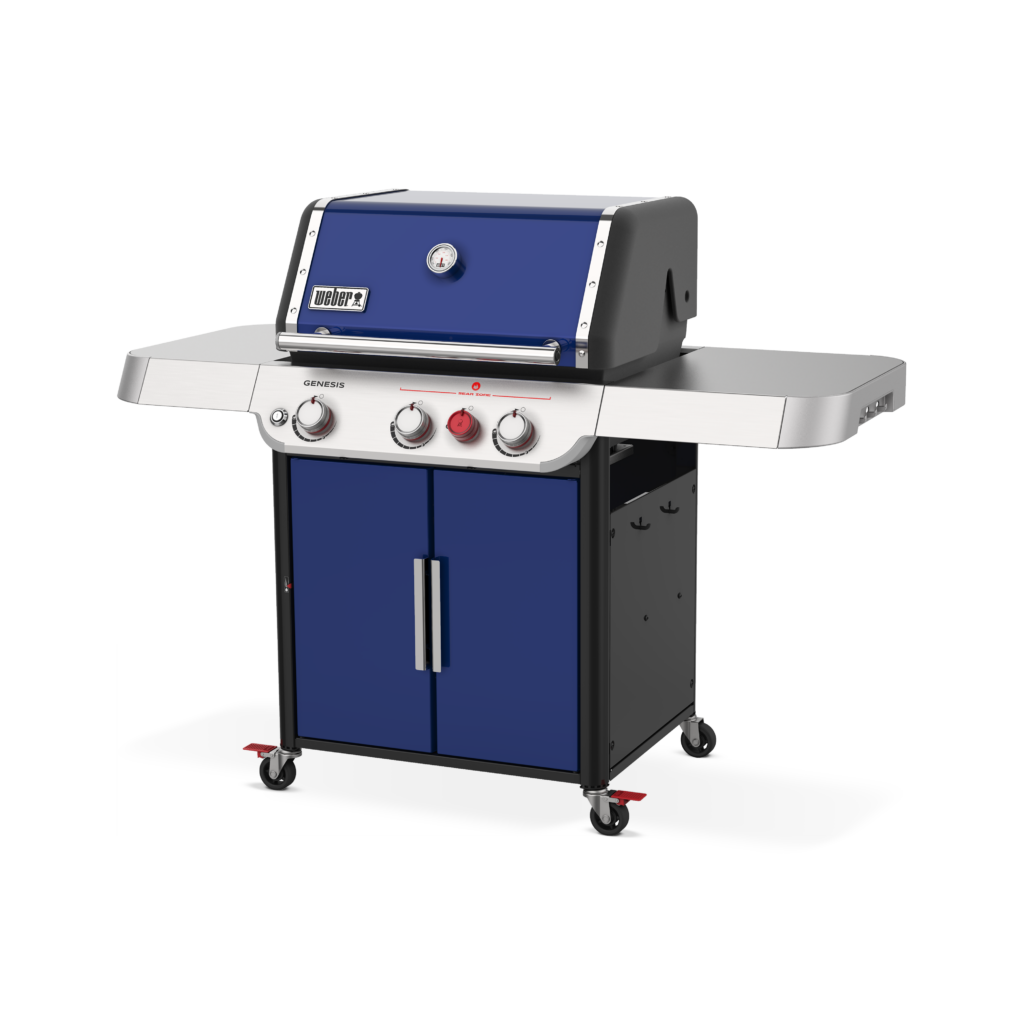 A modern Weber Genesis Deep Ocean Blue SP-E-325s Propane Grill with a closed lid, featuring three control knobs, a thermometer, side shelves, and a two-door cabinet on wheels.