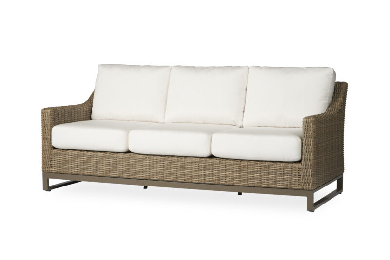A modern three-seater outdoor sofa with a brown wicker frame and white cushions, set against a plain white background.