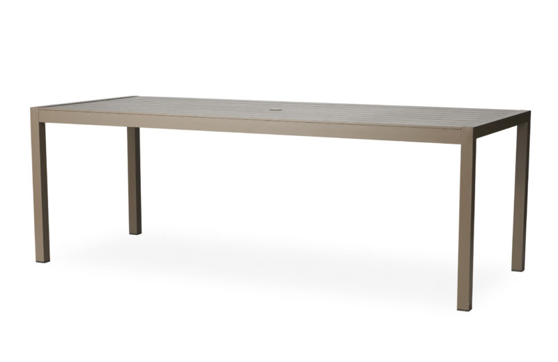 A modern, elongated rectangular table with a slatted top and four slender legs, presented in a light beige color against a white background.