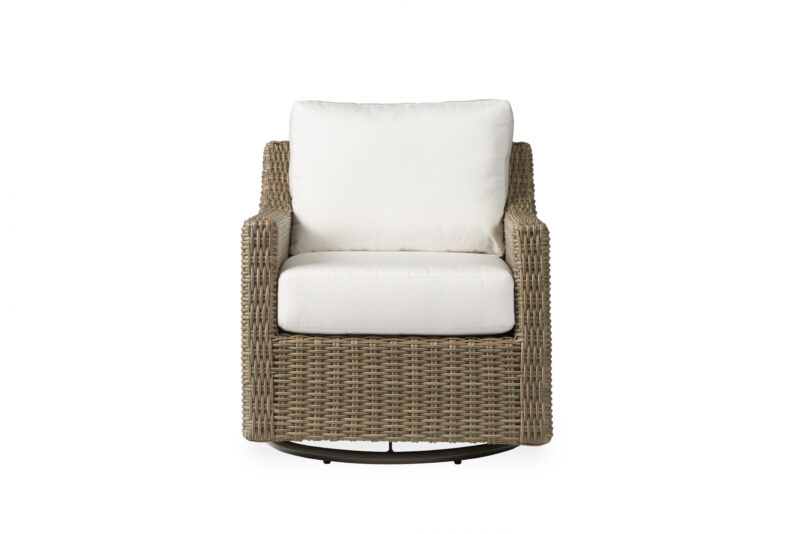 A modern outdoor swivel chair with a brown wicker frame and plush white cushions on a white background.