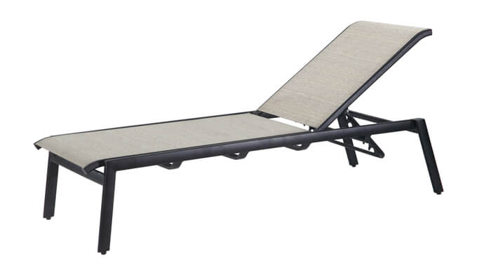 A modern Gensun Echelon outdoor chaise lounge with a sleek black frame and light gray fabric, isolated on a white background.