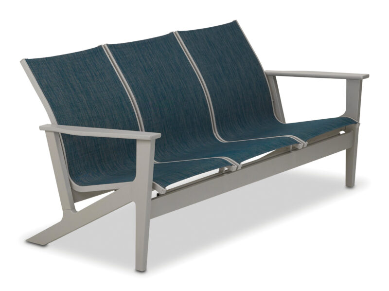 A modern outdoor bench with a sleek gray metal frame and three plush blue cushions on a white background.