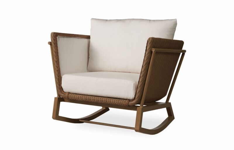 Modern rocking chair with a brown woven frame and white cushions on a white background.