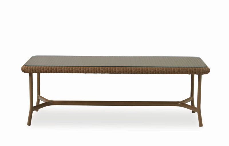 A rectangular brown wicker coffee table with a wooden frame and legs, isolated on a white background.