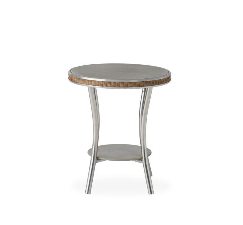 A small, round side table with a textured, neutral-colored top and a metallic, curved leg base, against a plain white background.