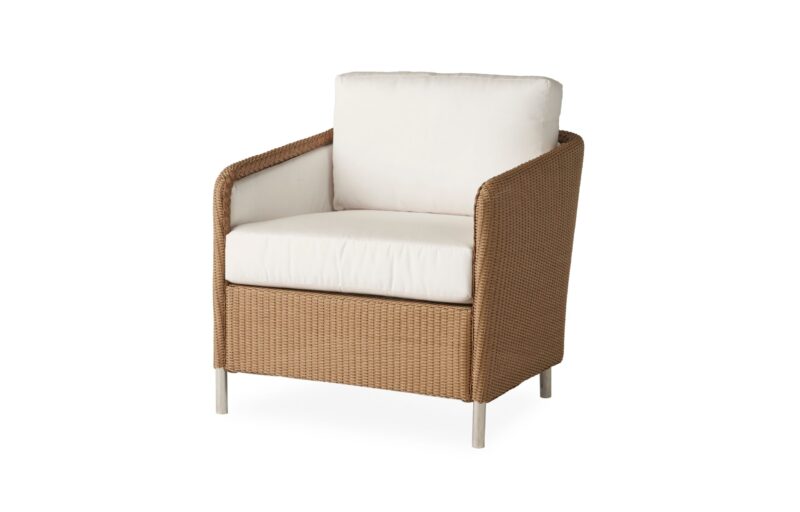 A modern outdoor armchair with a woven brown frame and white cushions, isolated on a white background.