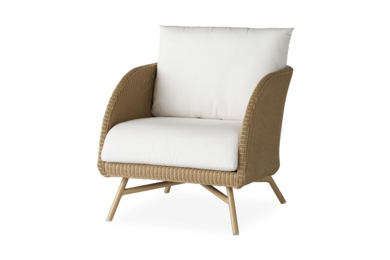 Modern essence wicker armchair with beige cushions on a white background.