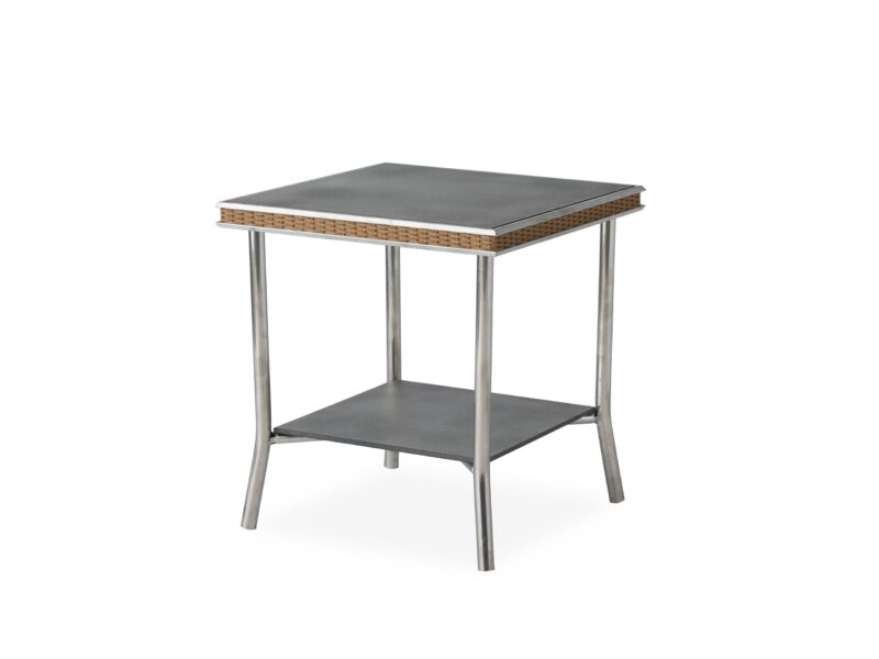 A modern side table with a woven rattan edge, sleek metal legs, and a solid gray top and shelf, isolated on a white background.