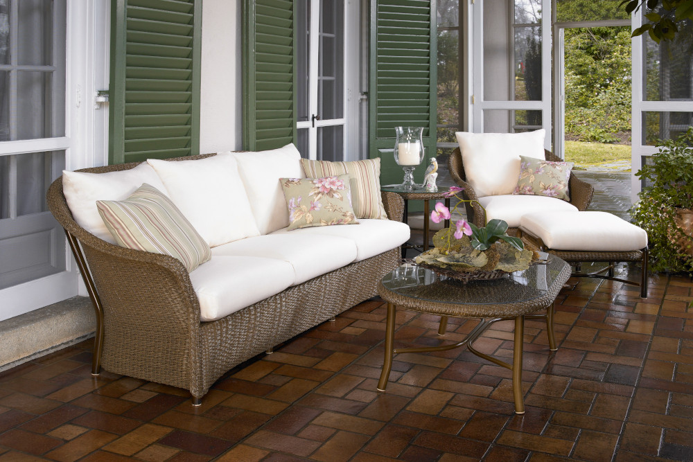 Woven dark brown vinyl patio set from the Weekend Retreat Collection by Lloyd Flanders with white cushioning