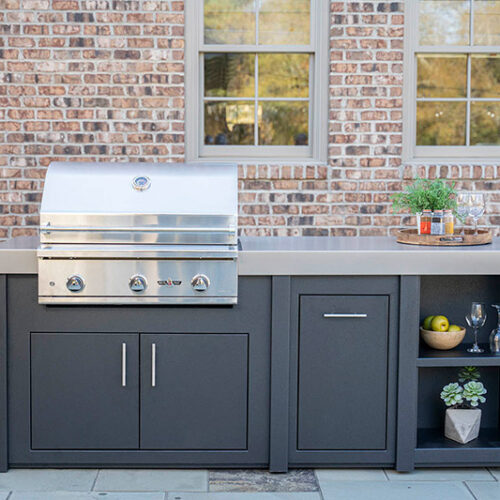 Stoll outdoor kitchen, brick house in background