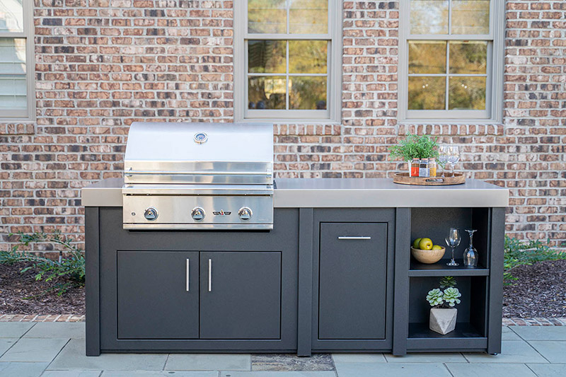Stoll outdoor kitchen, brick house in background