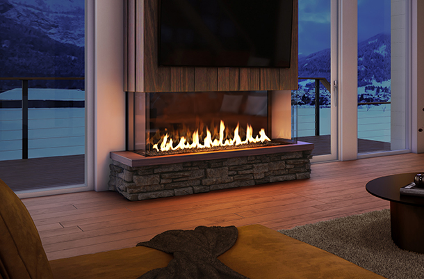 A cozy room with a lit fireplace, overlooking a snowy mountain landscape through large windows during twilight. modern furnishings and warm lighting create a relaxing ambience.
