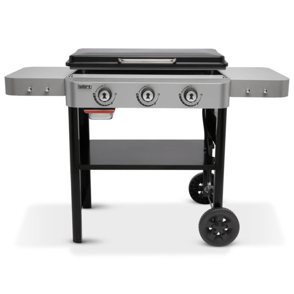 A Weber Griddle 28" with three control knobs, two side shelves, and wheels for mobility, displayed on a white background.