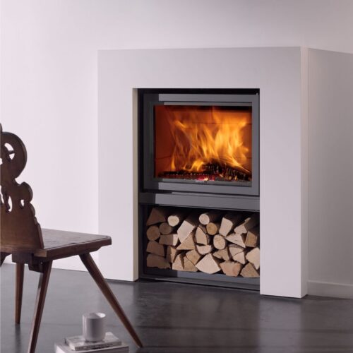 A modern fireplace with logs and a chair.