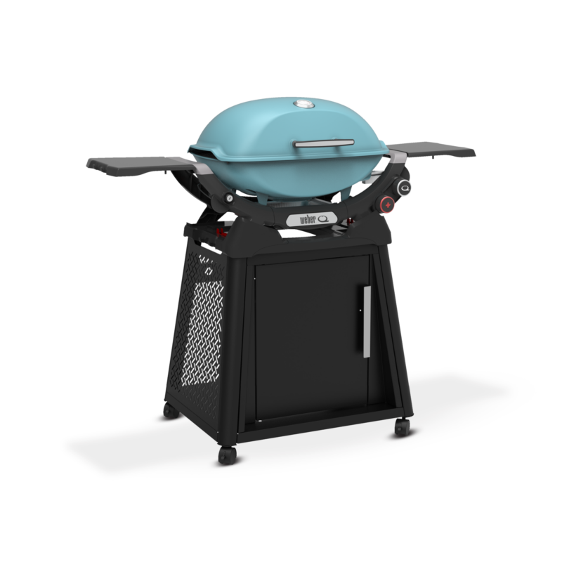 A modern, turquoise barbecue grill with an open lid and side trays, mounted on a black cart with wheels and a cabinet.