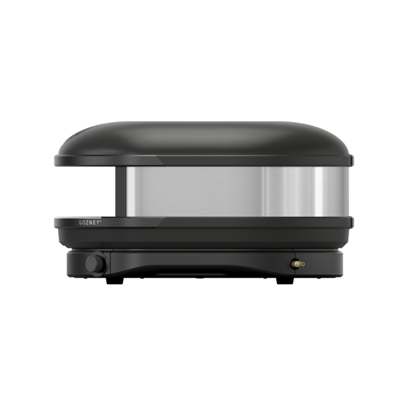 A black and silver compact pizza oven with a sleek, modern design, featuring a visible brand label "gozney.